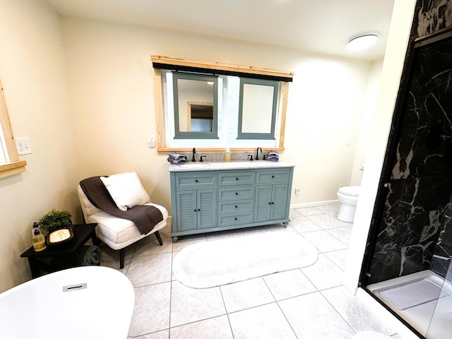 23479 State 200, Itasca Twp, MN 56676 - full bath with double vanity, toilet, a shower stall, a freestanding tub, and tile patterned flooring