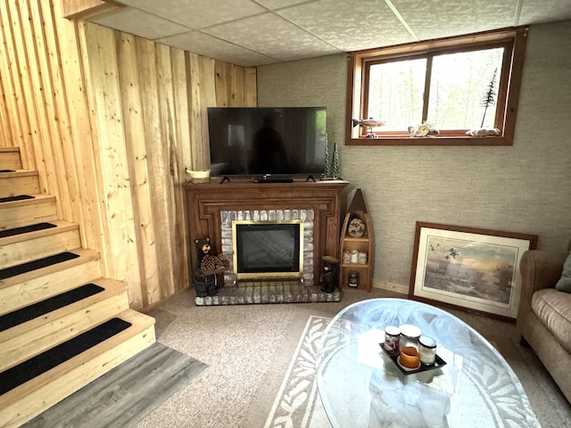 23479 State 200, Itasca Twp, MN 56676 - living room with a brick fireplace, a drop ceiling, stairs, and carpet floors
