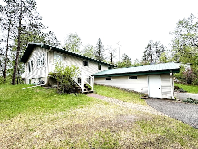 23479 State 200, Itasca Twp, MN 56676 - rear view of house with a lawn and an outdoor structure