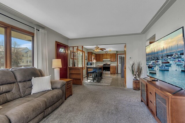 living area with light carpet and a ceiling fan