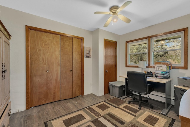 office area featuring light wood finished floors and a ceiling fan