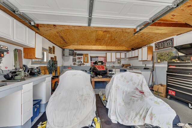 garage featuring a wall mounted AC