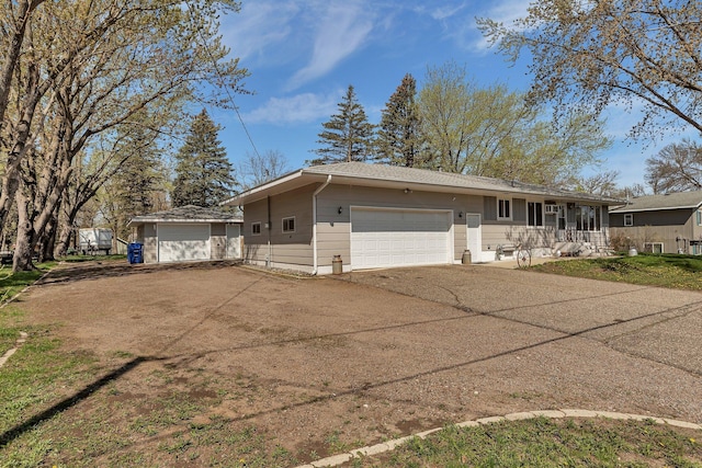 ranch-style home featuring driveway and a garage
