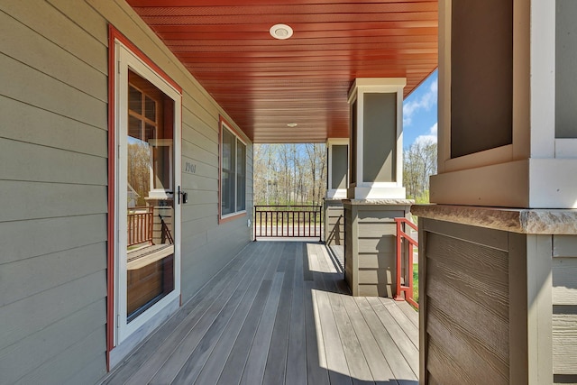 1901 11th St N, Sartell, MN 56377 - wooden deck featuring covered porch