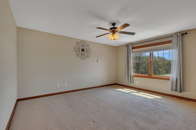 1901 11th St N, Sartell, MN 56377 - spare room with baseboards, ceiling fan, and carpet