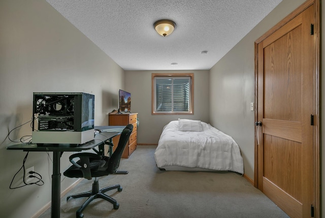 1908 5th St N, Sartell, MN 56377 - bedroom with light colored carpet, a desk, baseboards, and a textured ceiling