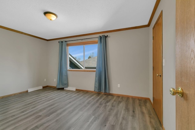 1908 5th St N, Sartell, MN 56377 - empty room featuring ornamental molding, wood finished floors, and baseboards