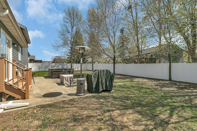 1908 5th St N, Sartell, MN 56377 - fenced backyard featuring a hot tub and a patio