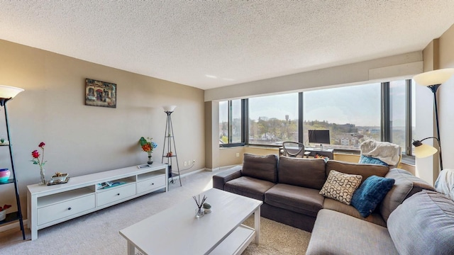 carpeted living room with a textured ceiling and baseboards