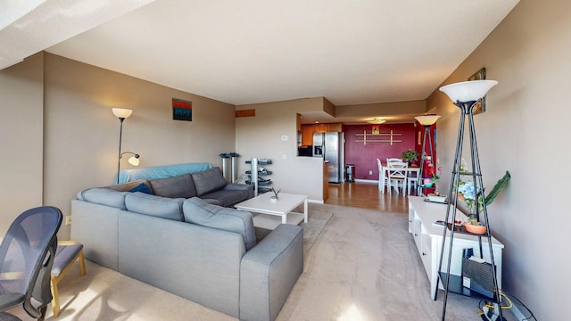 living area featuring light colored carpet