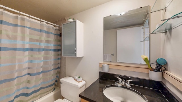full bathroom with vanity, shower / bath combination with curtain, and toilet