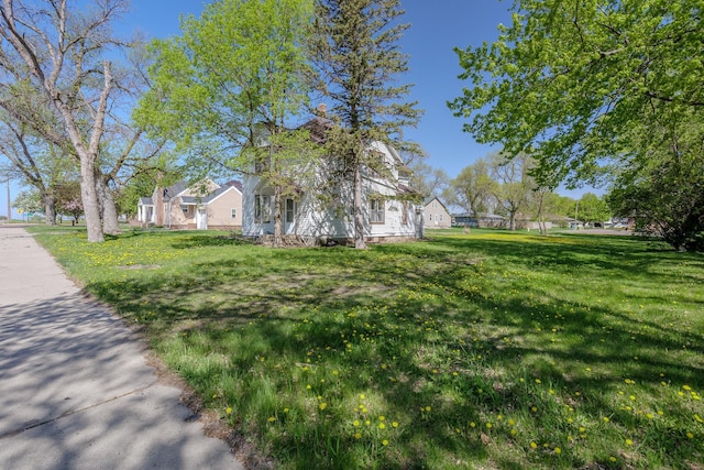 414 4th St, Winthrop, MN 55396 - view of side of property with a lawn