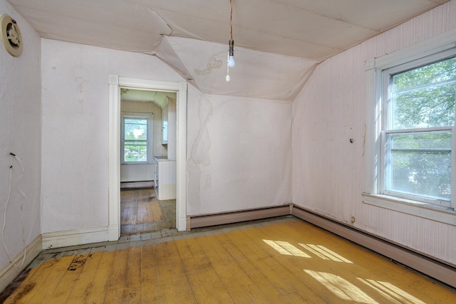 414 4th St, Winthrop, MN 55396 - bonus room with lofted ceiling, hardwood / wood-style flooring, and baseboard heating
