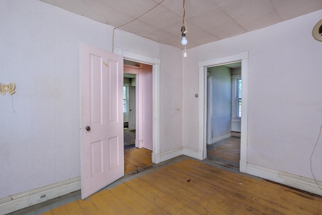 414 4th St, Winthrop, MN 55396 - unfurnished room featuring hardwood / wood-style floors, baseboards, and plenty of natural light