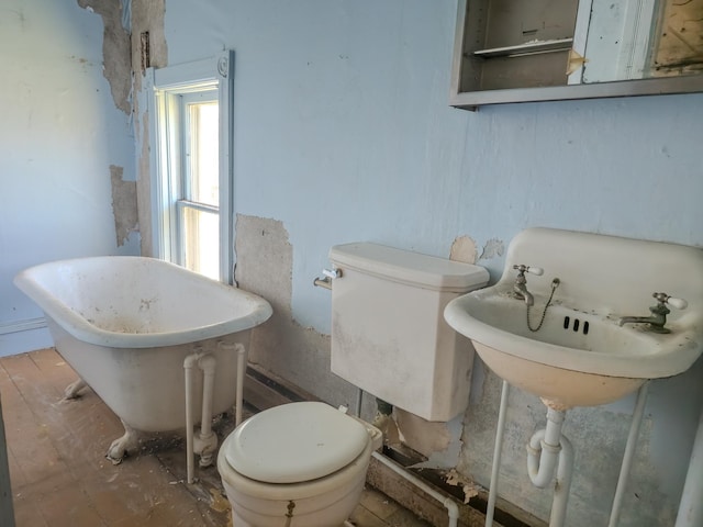414 4th St, Winthrop, MN 55396 - full bath featuring toilet, a soaking tub, and a sink