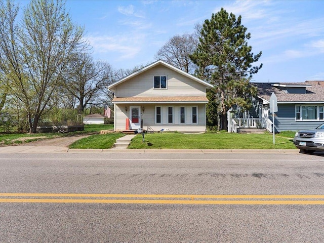 bungalow-style home featuring a front yard