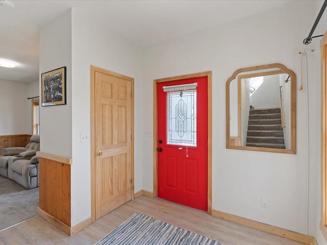 611 3rd St SW, Crosby, MN 56441 - foyer entrance featuring light wood-style flooring, stairs, and baseboards