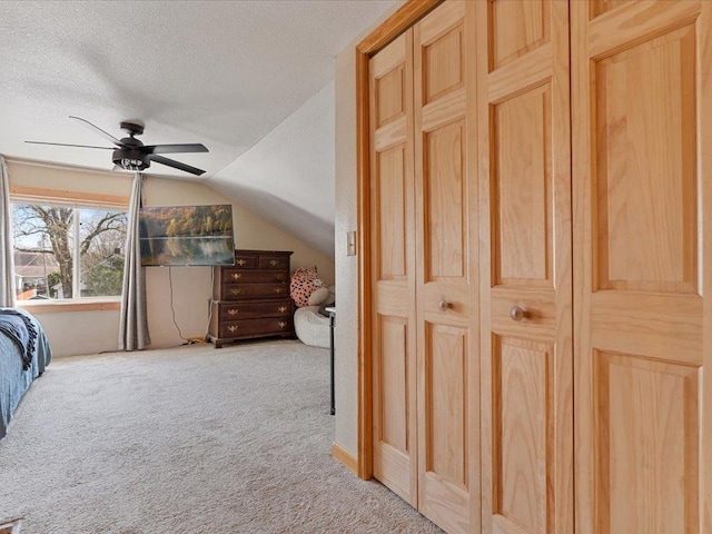 611 3rd St SW, Crosby, MN 56441 - carpeted bedroom featuring a textured ceiling, lofted ceiling, and ceiling fan