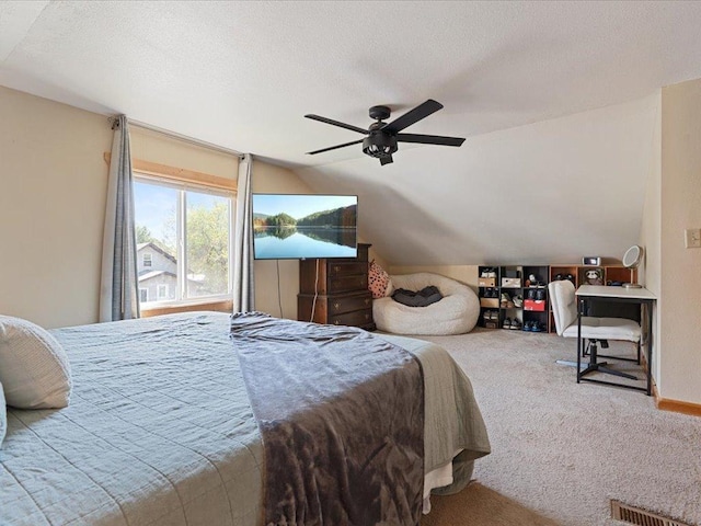 611 3rd St SW, Crosby, MN 56441 - carpeted bedroom with vaulted ceiling, baseboards, and a ceiling fan