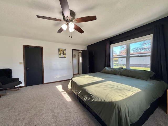 513 Water Ave N, Saint Hilaire, MN 56754 - bedroom featuring carpet floors, a textured ceiling, ceiling fan, and baseboards