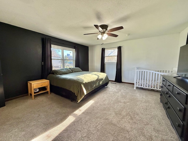 513 Water Ave N, Saint Hilaire, MN 56754 - bedroom featuring light carpet, a textured ceiling, ceiling fan, and baseboards