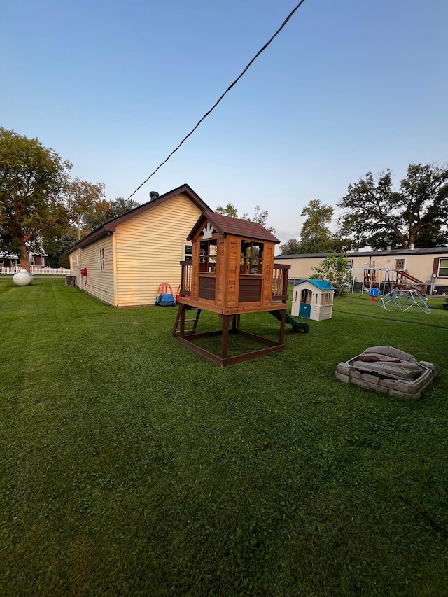 513 Water Ave N, Saint Hilaire, MN 56754 - view of grassy yard featuring exterior structure and an outbuilding