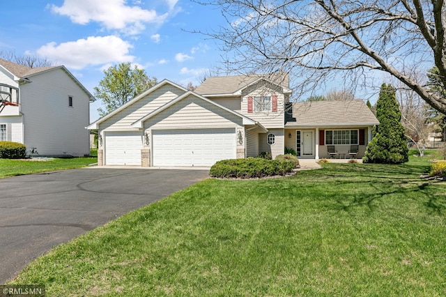 traditional-style home with driveway, a garage, and a front lawn