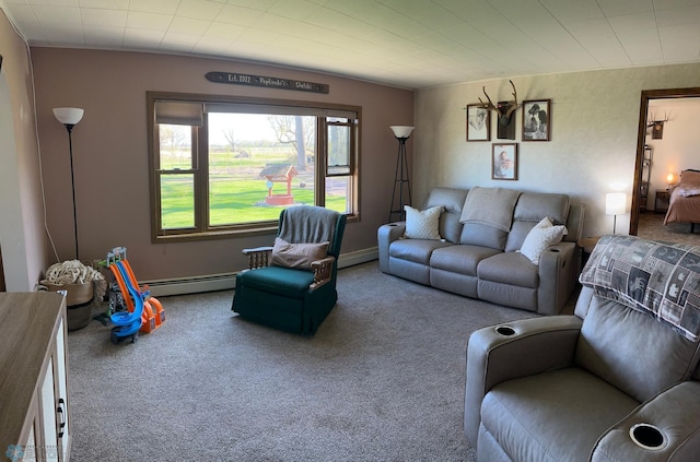 carpeted living area with baseboard heating