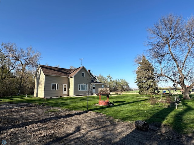view of property exterior featuring a lawn