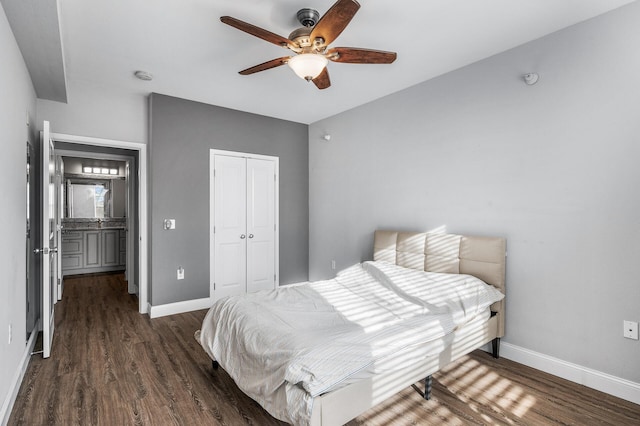 bedroom featuring wood finished floors, a closet, baseboards, and a ceiling fan