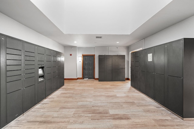surrounding community with a package area and recessed lighting