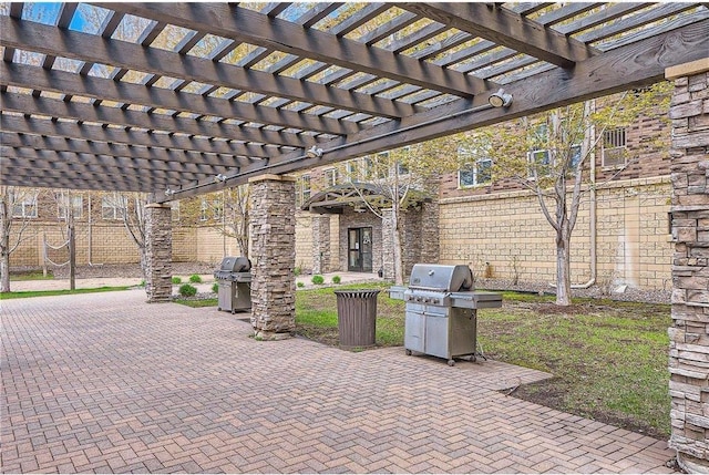 view of patio with grilling area and a fenced backyard