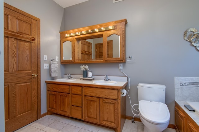 532 150th St, Alden Twp, WI 54001 - bathroom featuring toilet, tile patterned floors, double vanity, and a bath