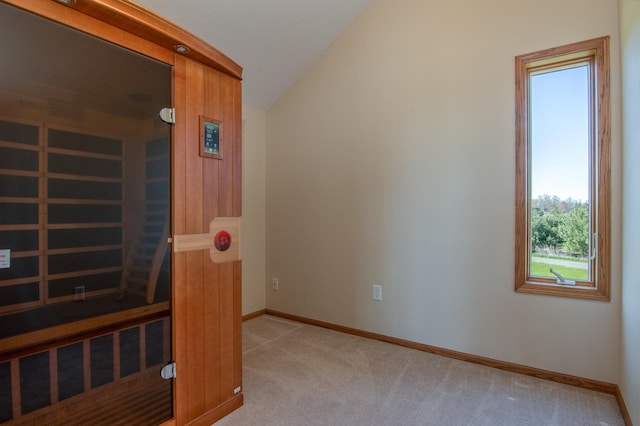 532 150th St, Alden Twp, WI 54001 - empty room featuring vaulted ceiling, light colored carpet, and baseboards