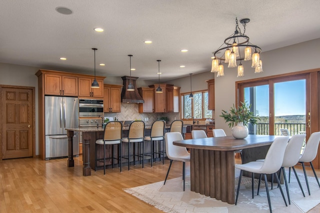 532 150th St, Alden Twp, WI 54001 - dining room with recessed lighting, light wood-style floors, a chandelier, and a textured ceiling