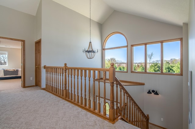532 150th St, Alden Twp, WI 54001 - stairway with high vaulted ceiling, carpet flooring, a chandelier, and baseboards