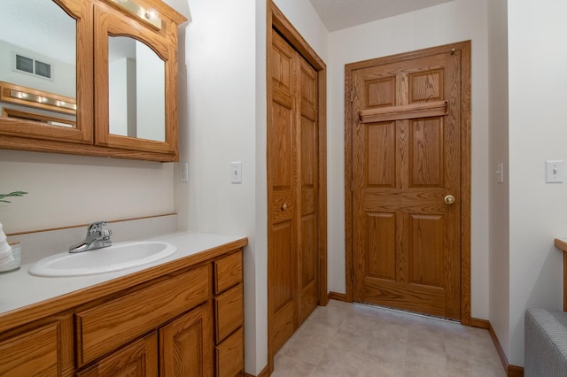 532 150th St, Alden Twp, WI 54001 - bathroom featuring vanity and baseboards