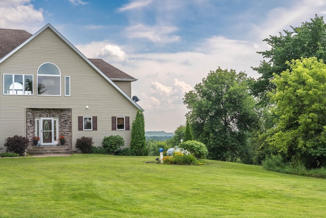 532 150th St, Alden Twp, WI 54001 - rear view of property with a yard and a shingled roof