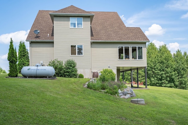 532 150th St, Alden Twp, WI 54001 - rear view of property with a yard and roof with shingles