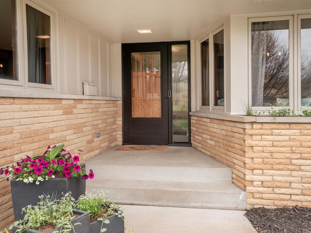 3509 Coolidge St NE, Saint Anthony, MN 55418 - view of exterior entry featuring brick siding