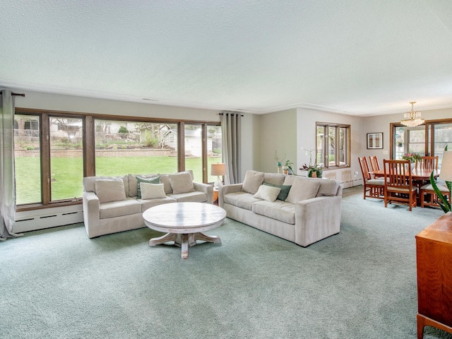 3509 Coolidge St NE, Saint Anthony, MN 55418 - carpeted living area featuring baseboard heating, plenty of natural light, and a chandelier