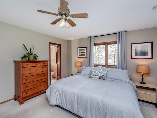 3509 Coolidge St NE, Saint Anthony, MN 55418 - bedroom featuring light carpet, ensuite bath, and ceiling fan