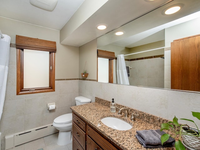 3509 Coolidge St NE, Saint Anthony, MN 55418 - bathroom with baseboard heating, tile walls, vanity, tile patterned floors, and a shower with curtain