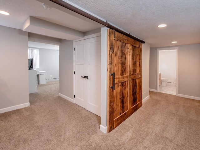 3509 Coolidge St NE, Saint Anthony, MN 55418 - hall with carpet flooring, recessed lighting, a barn door, and a textured ceiling