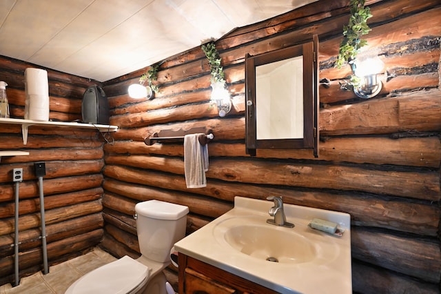9262 Park Ave, Solon Springs, WI 54873 - bathroom featuring vanity, toilet, log walls, and tile patterned flooring