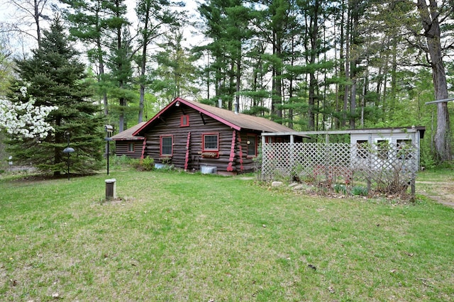 9262 Park Ave, Solon Springs, WI 54873 - view of home's exterior featuring log exterior and a lawn