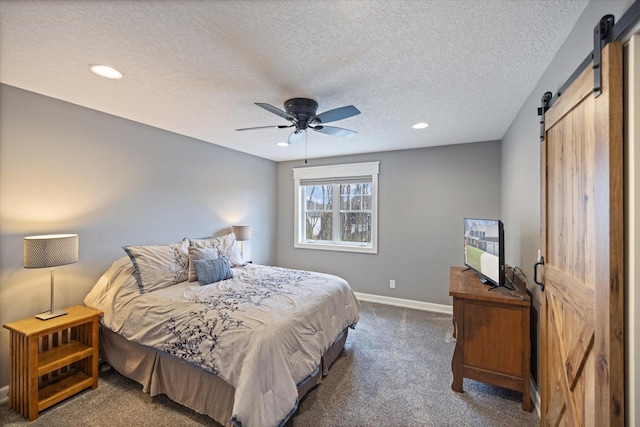 701 Chalupsky Ave SE, New Prague, MN 56071 - bedroom featuring a barn door, carpet flooring, baseboards, recessed lighting, and a textured ceiling
