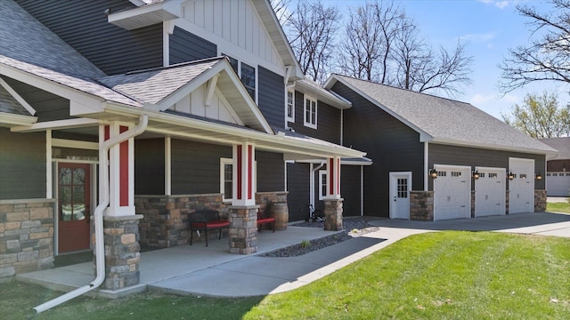 701 Chalupsky Ave SE, New Prague, MN 56071 - view of side of property featuring board and batten siding, stone siding, a porch, concrete driveway, and roof with shingles