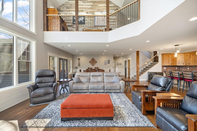 701 Chalupsky Ave SE, New Prague, MN 56071 - living room with wood finished floors, stairs, plenty of natural light, a high ceiling, and recessed lighting