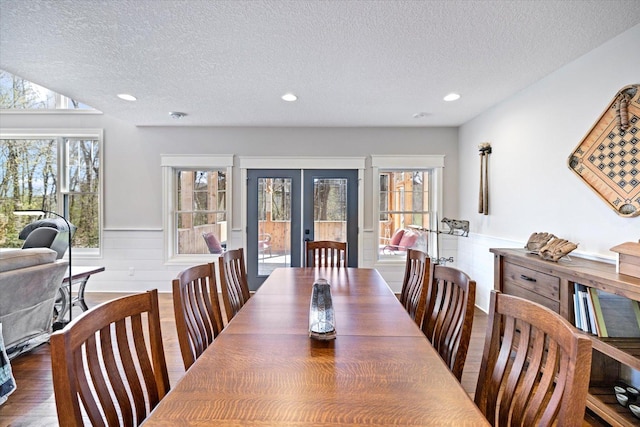 701 Chalupsky Ave SE, New Prague, MN 56071 - dining space featuring french doors, a textured ceiling, a wainscoted wall, plenty of natural light, and recessed lighting